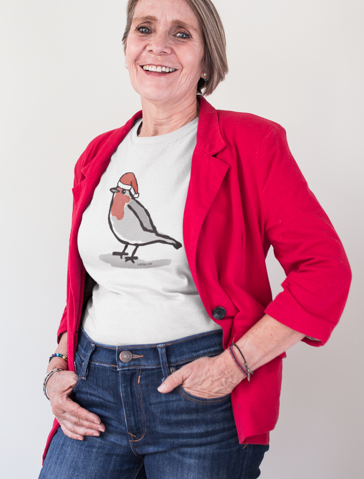 Woman wearing a Santa Robin cute Christmas T-shirt illustrated design by Hector and Bone on a vegan cotton t-shirt
