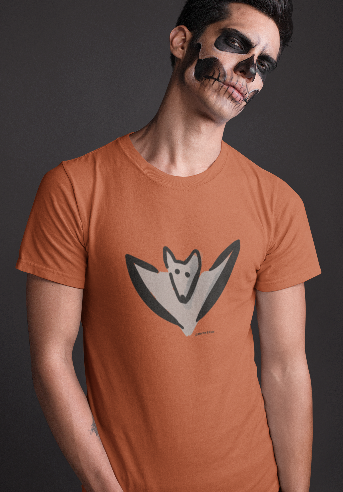 Bat T-shirt - Young man wearing an illustrated Bertie Bat T-shirt for Halloween orange colour vegan cotton tshirts by Hector and Bone