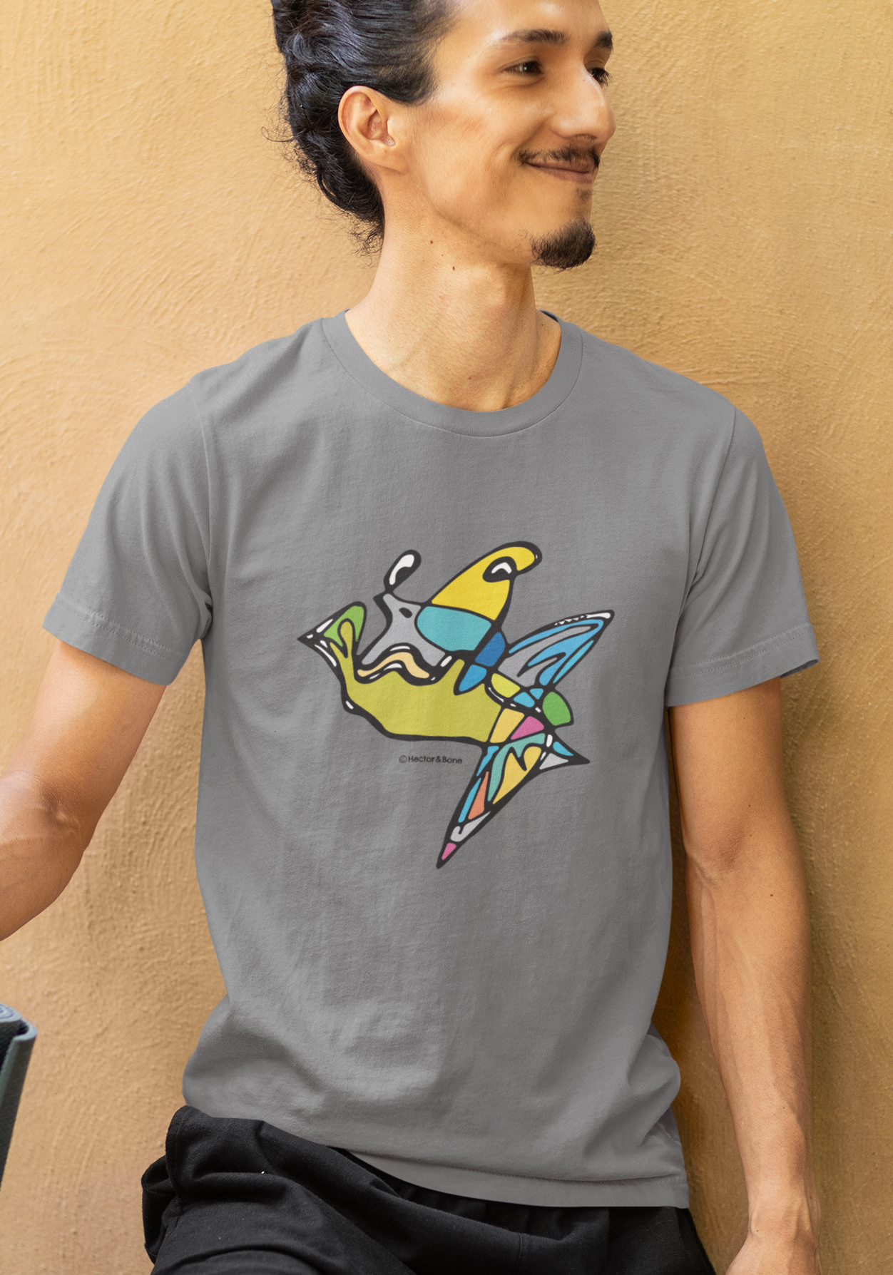 Man wearing a Fish Boy modern art design on a mid heather grey cotton vegan T-shirt by artist Hector and Bone