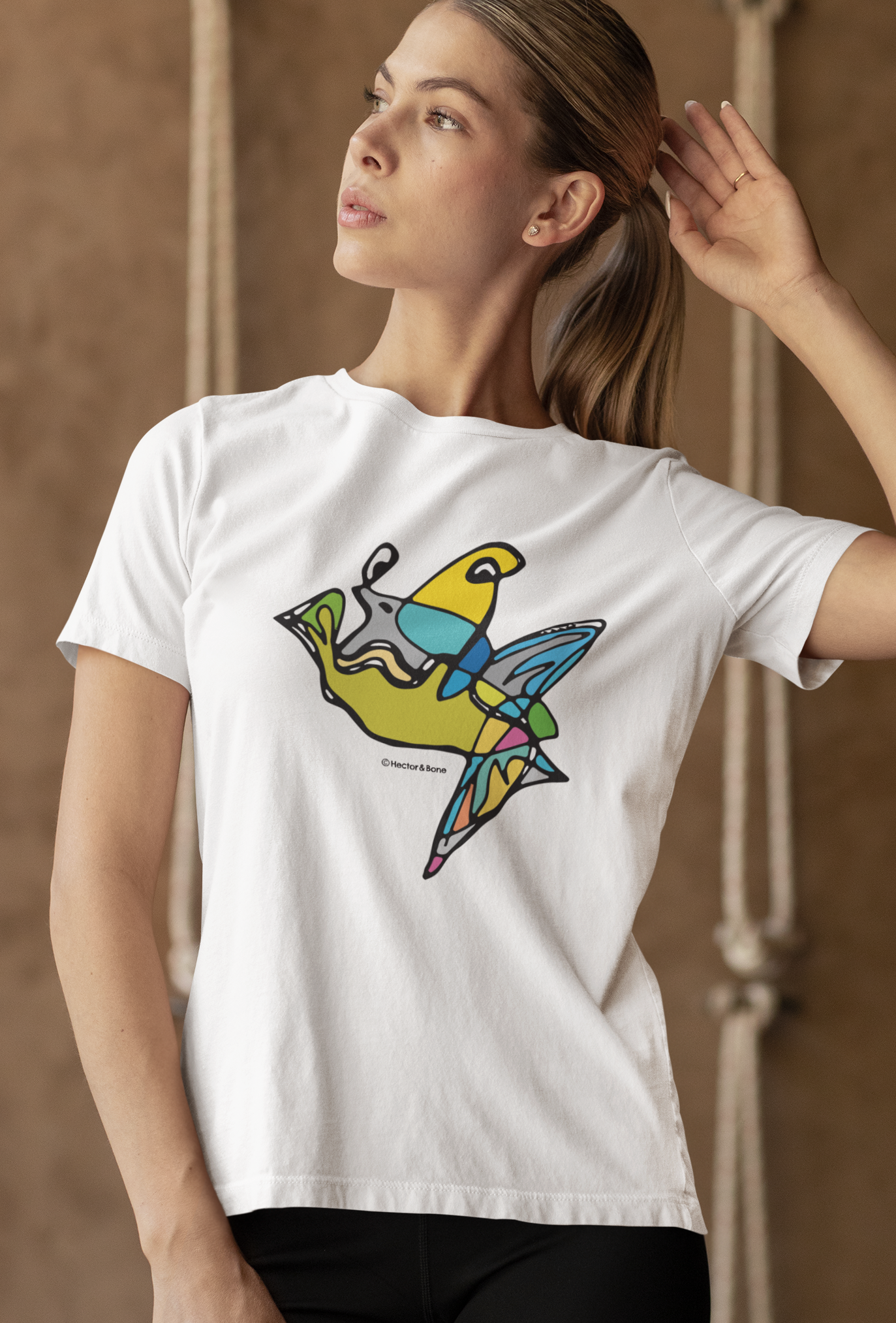 Young woman wearing a Fish Boy modern art design on a white cotton vegan T-shirt by artist Hector and Bone