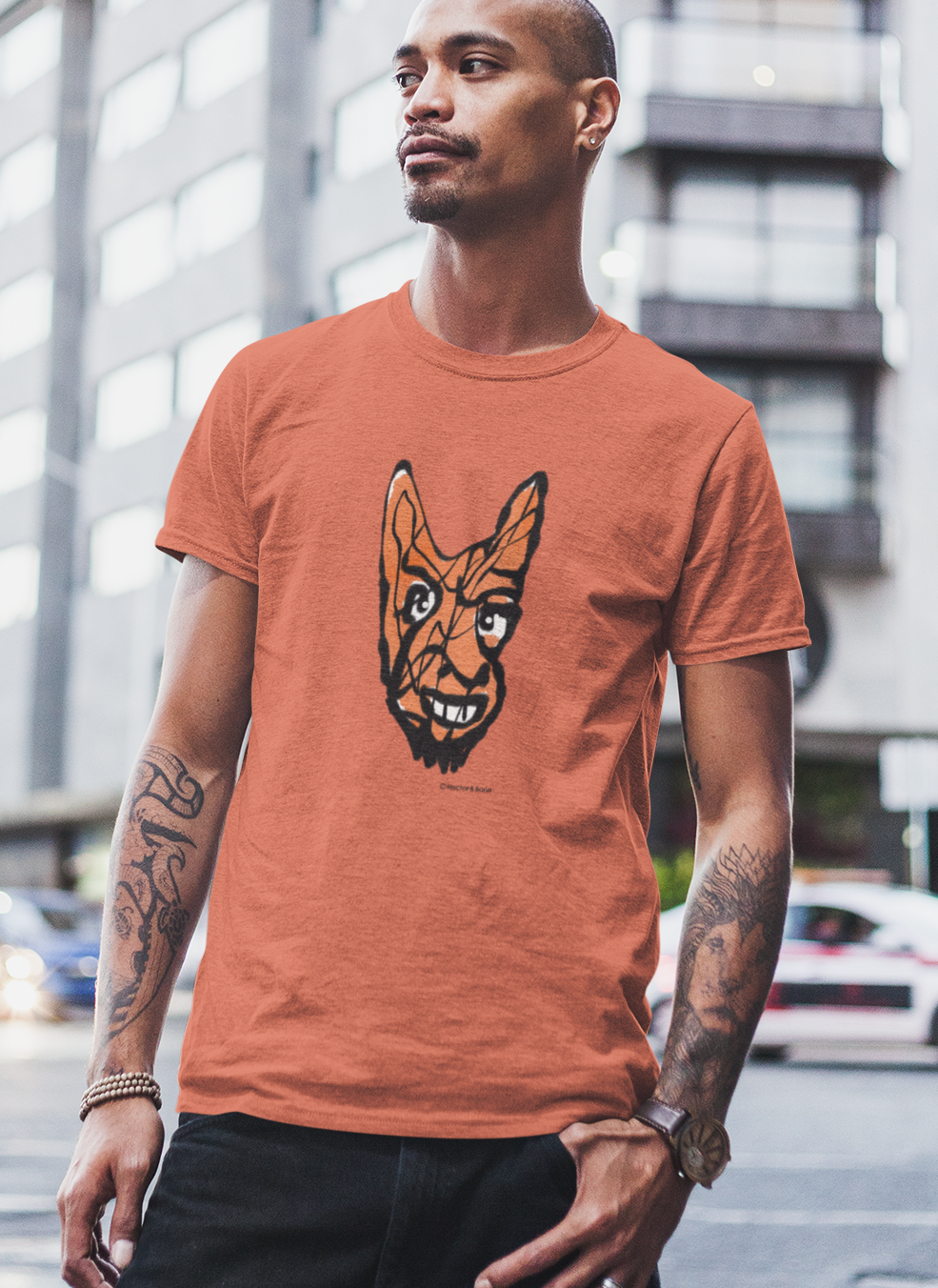 Devil T-shirt - Young man wearing Cheeky Little Devil illustrated orange vegan cotton t-shirts by Hector and Bone