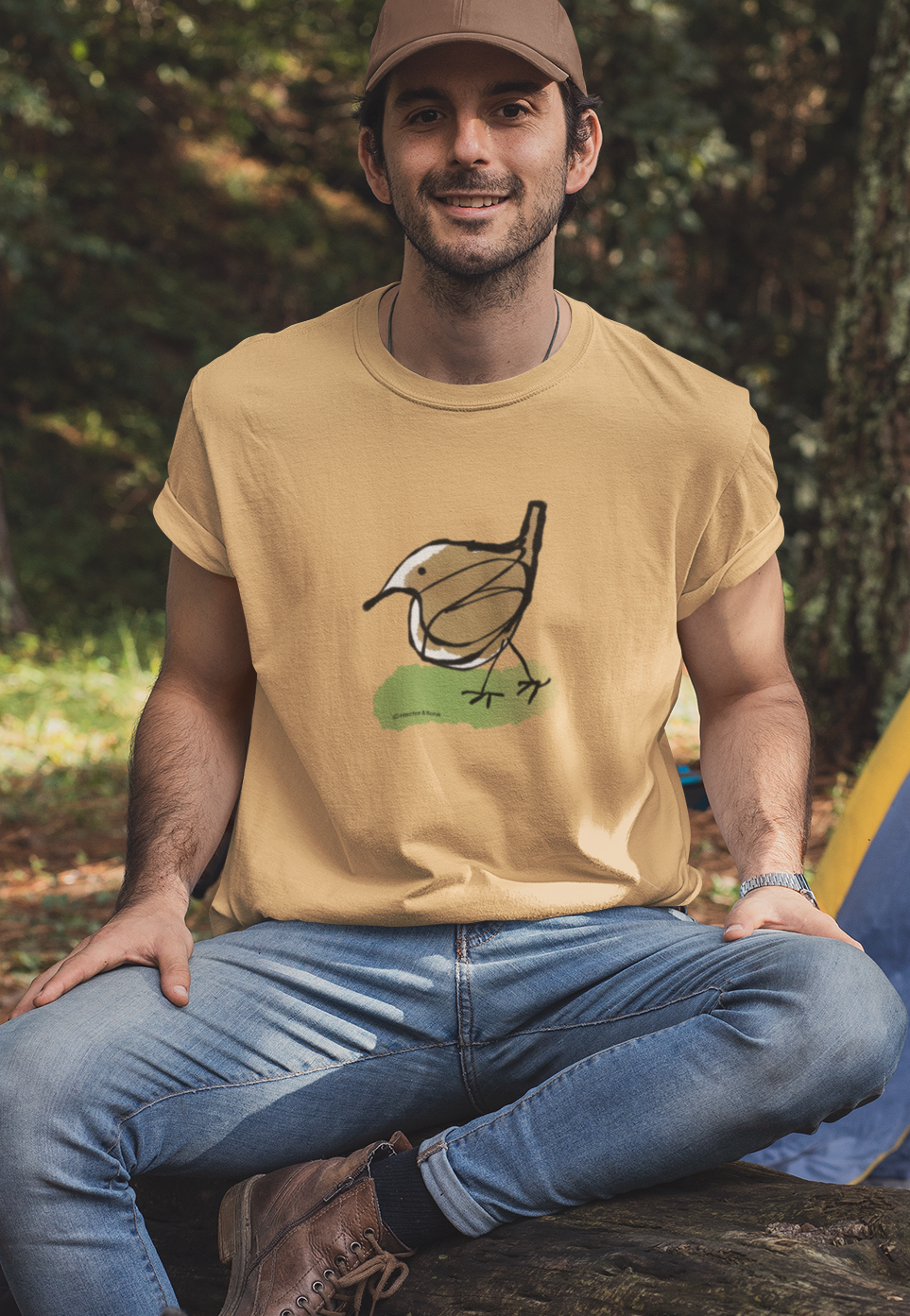 Jenny Wren T-shirt - Young man wearing illustrated little Jenny Wren bird t-shirt on nispero ochre colour vegan cotton t-shirts by Hector and Bone