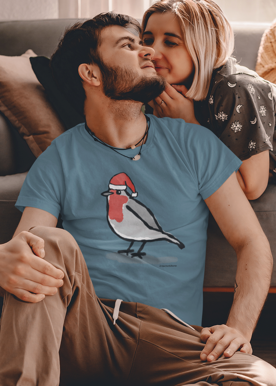 Young man at Xmas, wearing a illustrated Santa Christmas Robin T-shirt - Stargazer Blue colour vegan cotton Christmas T-shirts by Hector and Bone