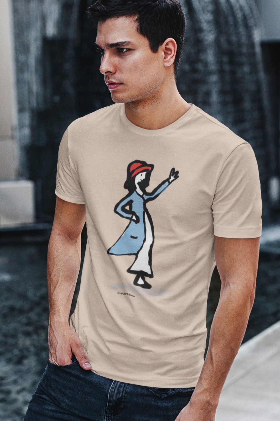 A cool young man wearing an illustrated waving girl t-shirt on heather rainbow vegan cotton tshirt by Hector and Bone