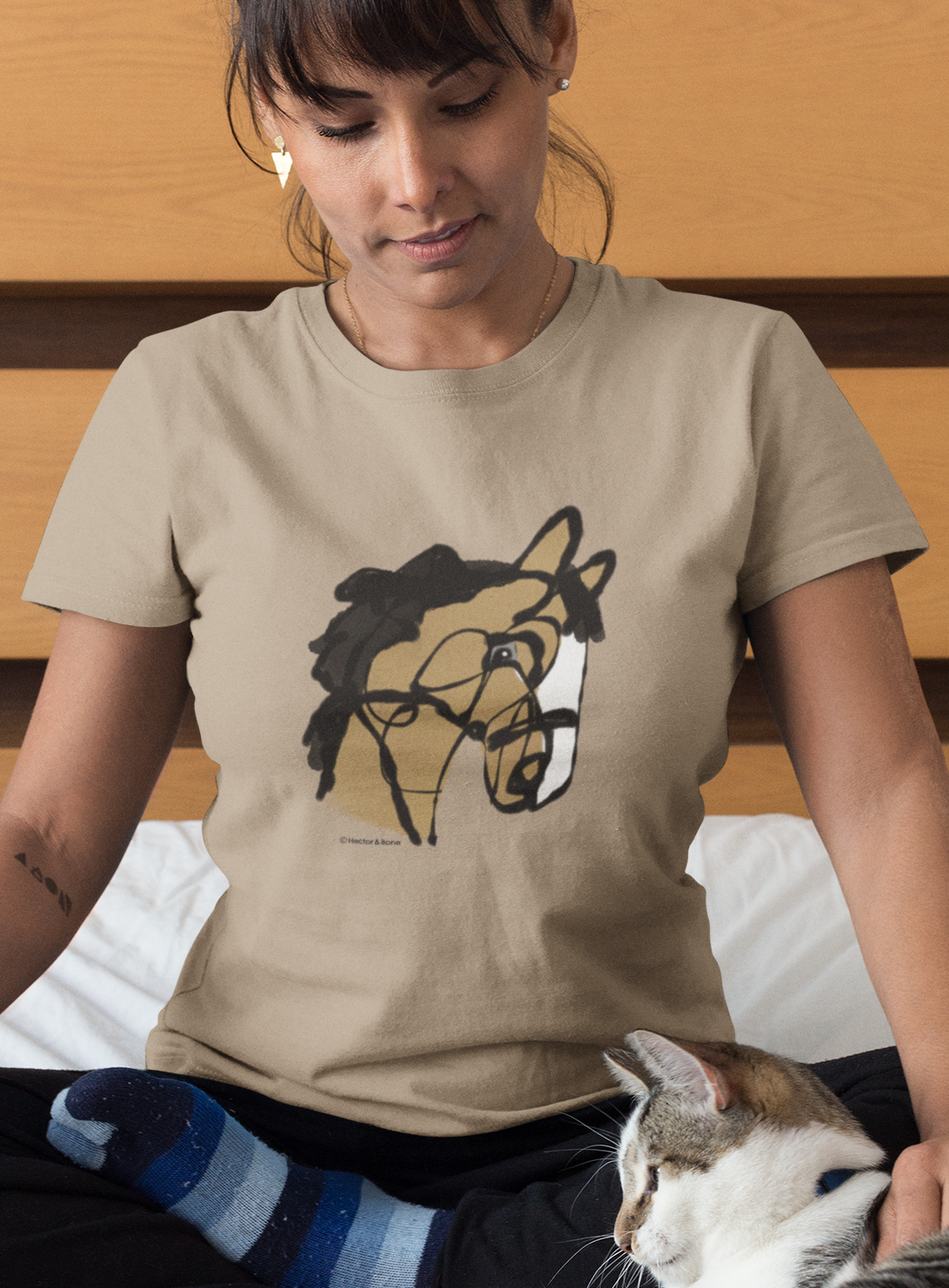 Horse T-shirt - Young woman wearing an illustrated horse lover original design printed on a camel colour vegan cotton pony t-shirt by Hector and Bone