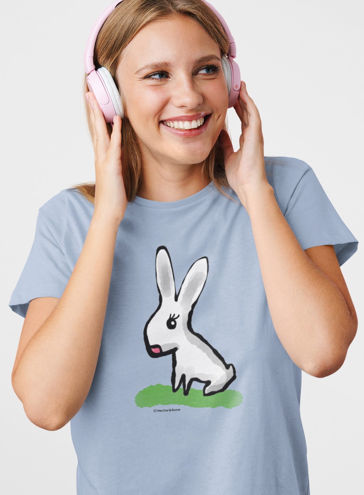 Young woman wearing a Cute Bunny T-shirt original illustrated design on sky blue colour vegan cotton t-shirts by Hector and Bone