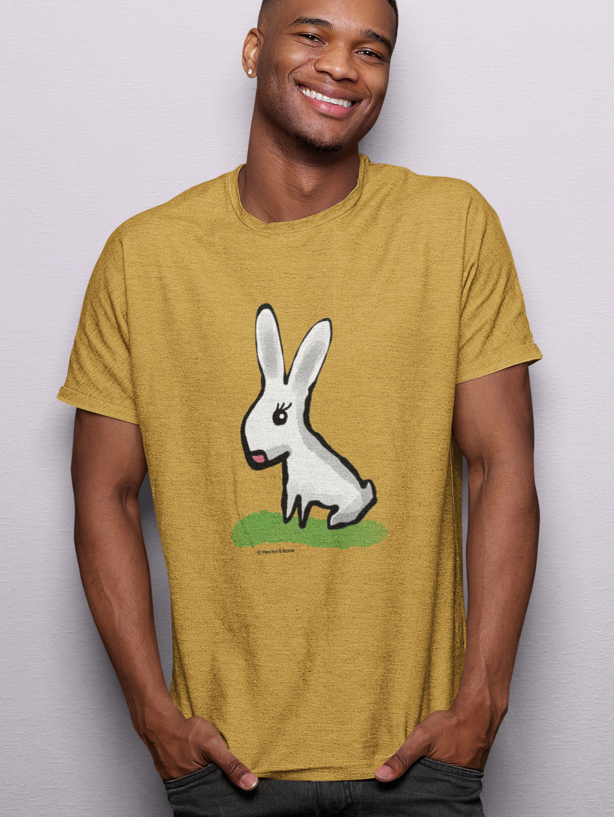 Cute Bunny T-shirt - Young man wearing original illustrated bunny design on ochre colour vegan cotton t-shirts by Hector and Bone