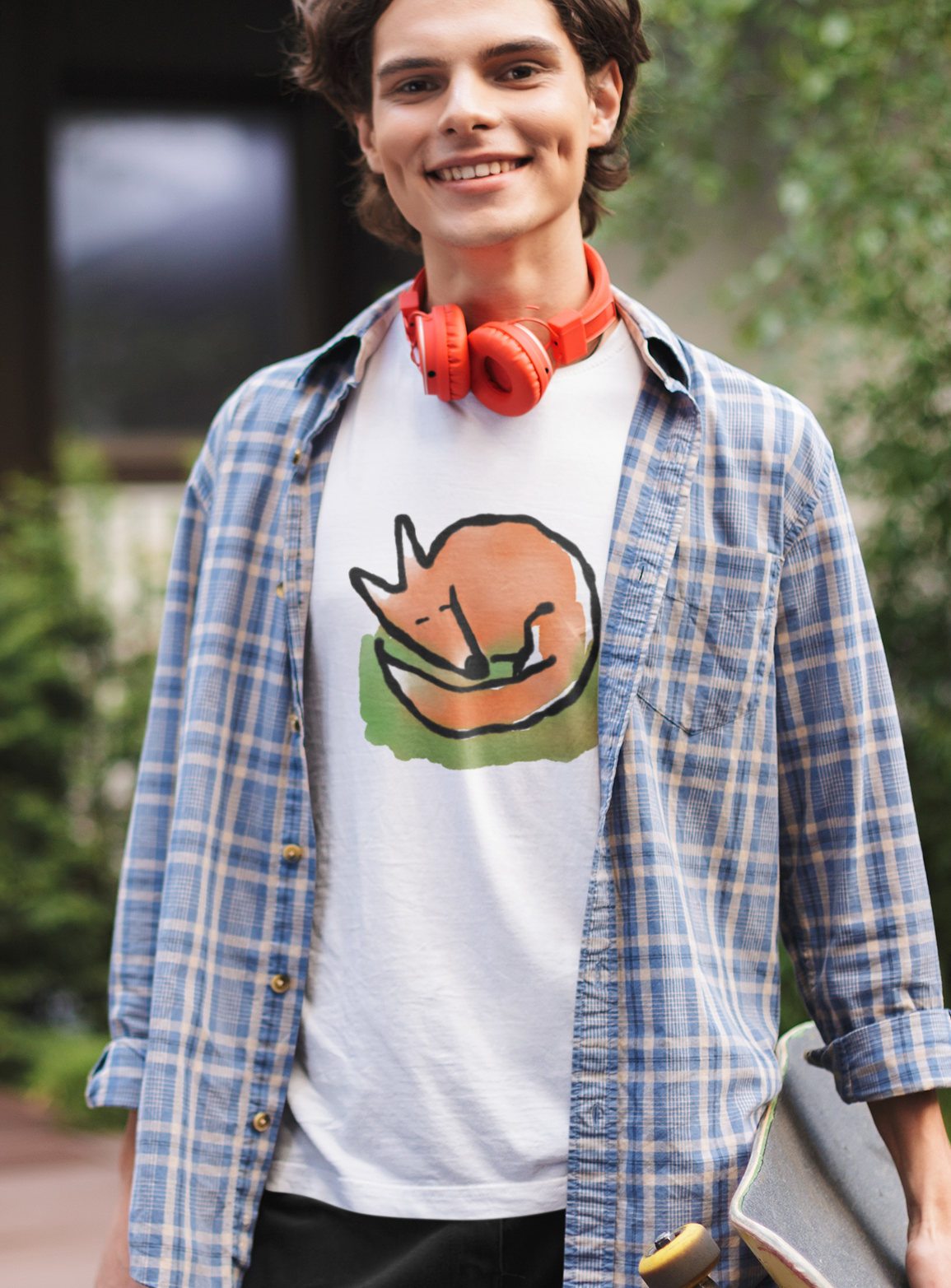 Young man wearing a cute Sleeping Fox illustrated cotton T-shirt. Original fox t-shirt design by Hector and Bone