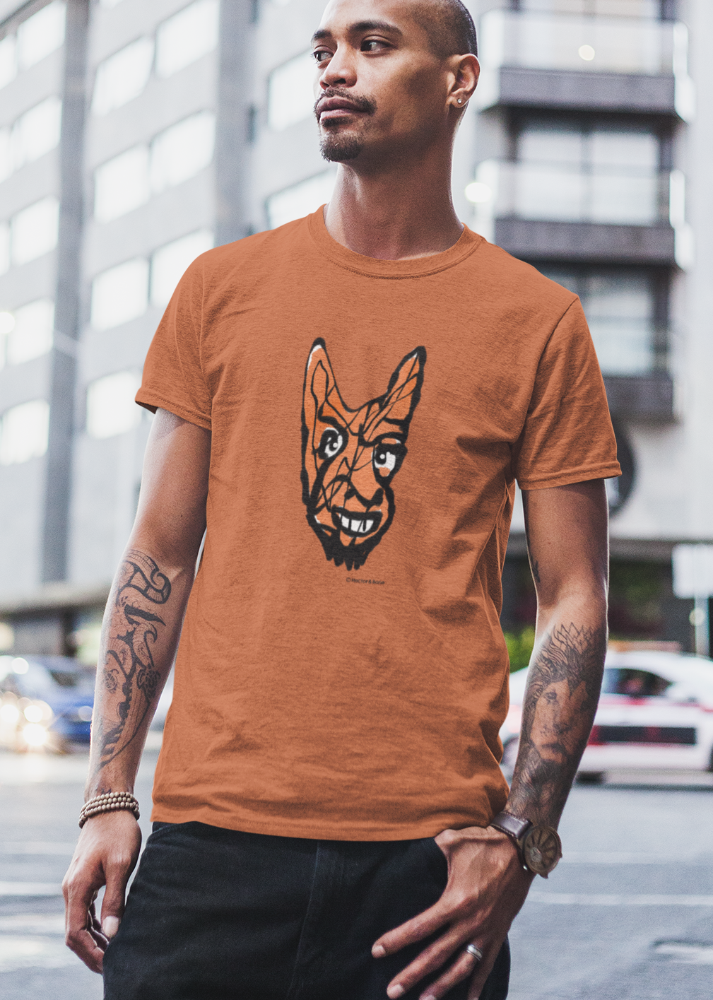 Devil T-shirt - Young man wearing Cheeky Little Devil illustrated orange vegan cotton t-shirts by Hector and Bone