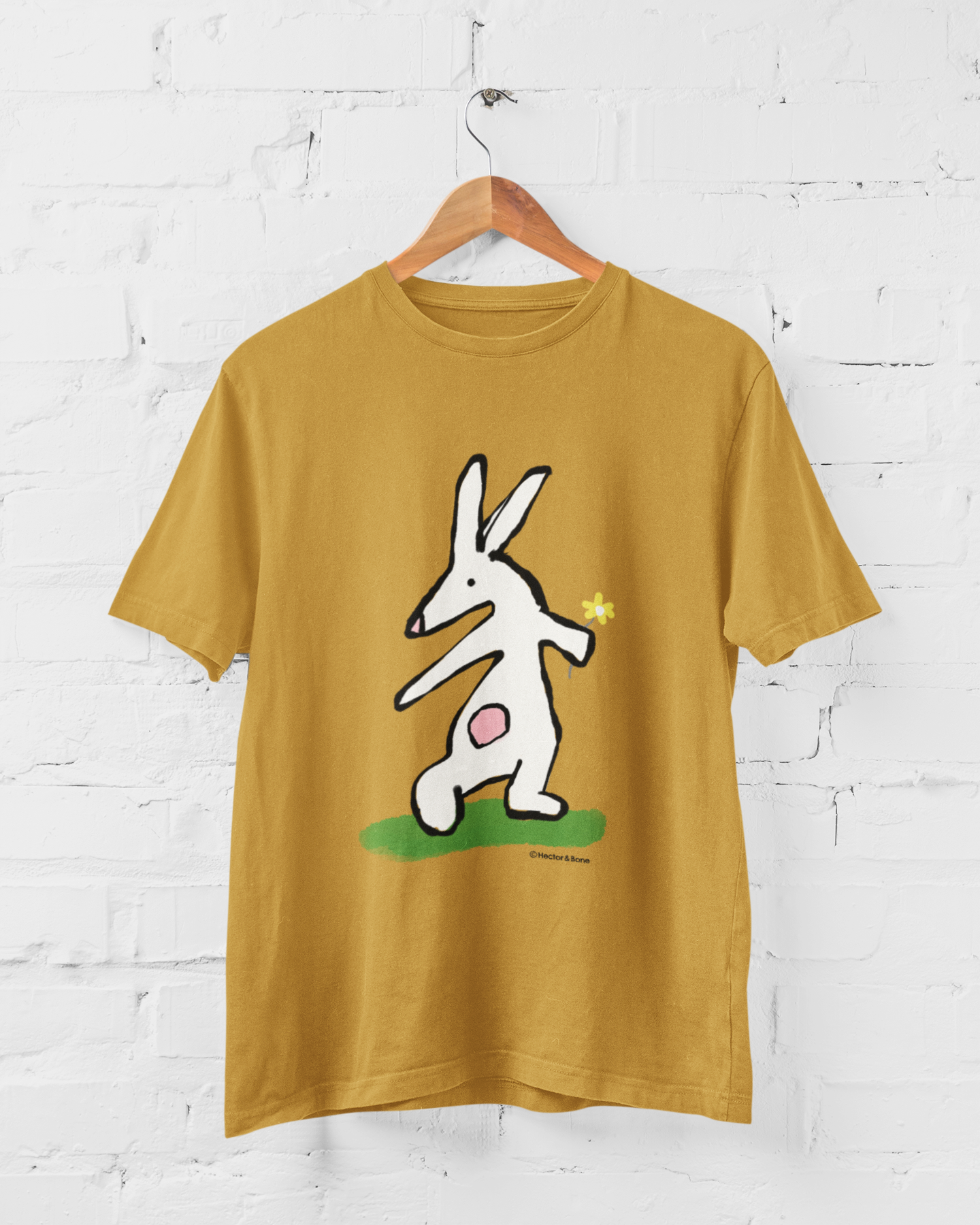 Bunny T-shirt - Illustrated rabbit holding a flower design on ochre colour vegan cotton - Easter Bunny t-shirts by Hector and Bone