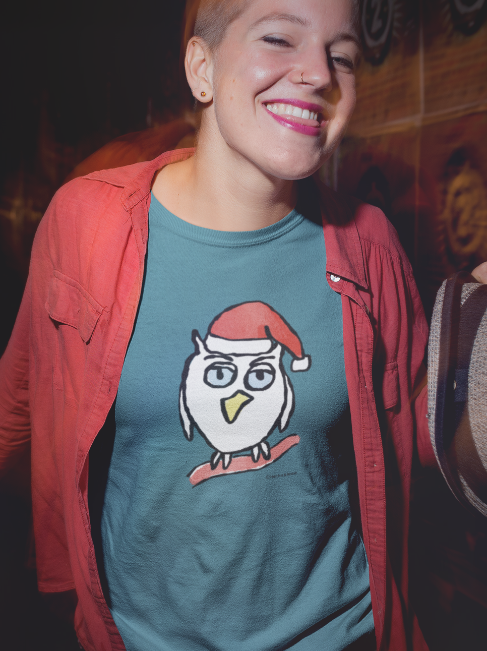 Santa Night Owl Christmas T-shirt - Happy young woman wearing an Illustrated funny Xmas night owl on a night blue vegan cotton t-shirt by Hector and Bone