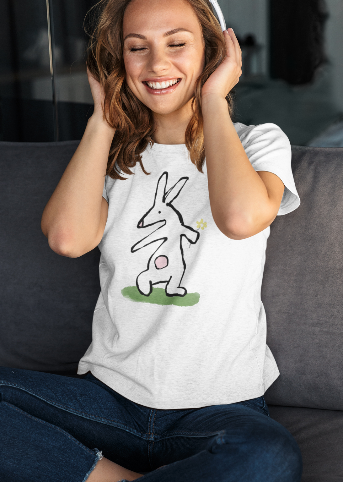 Happy young woman wearing a Flower Bunny illustrated Rabbit T-shirt design on white vegan cotton by Hector and Bone