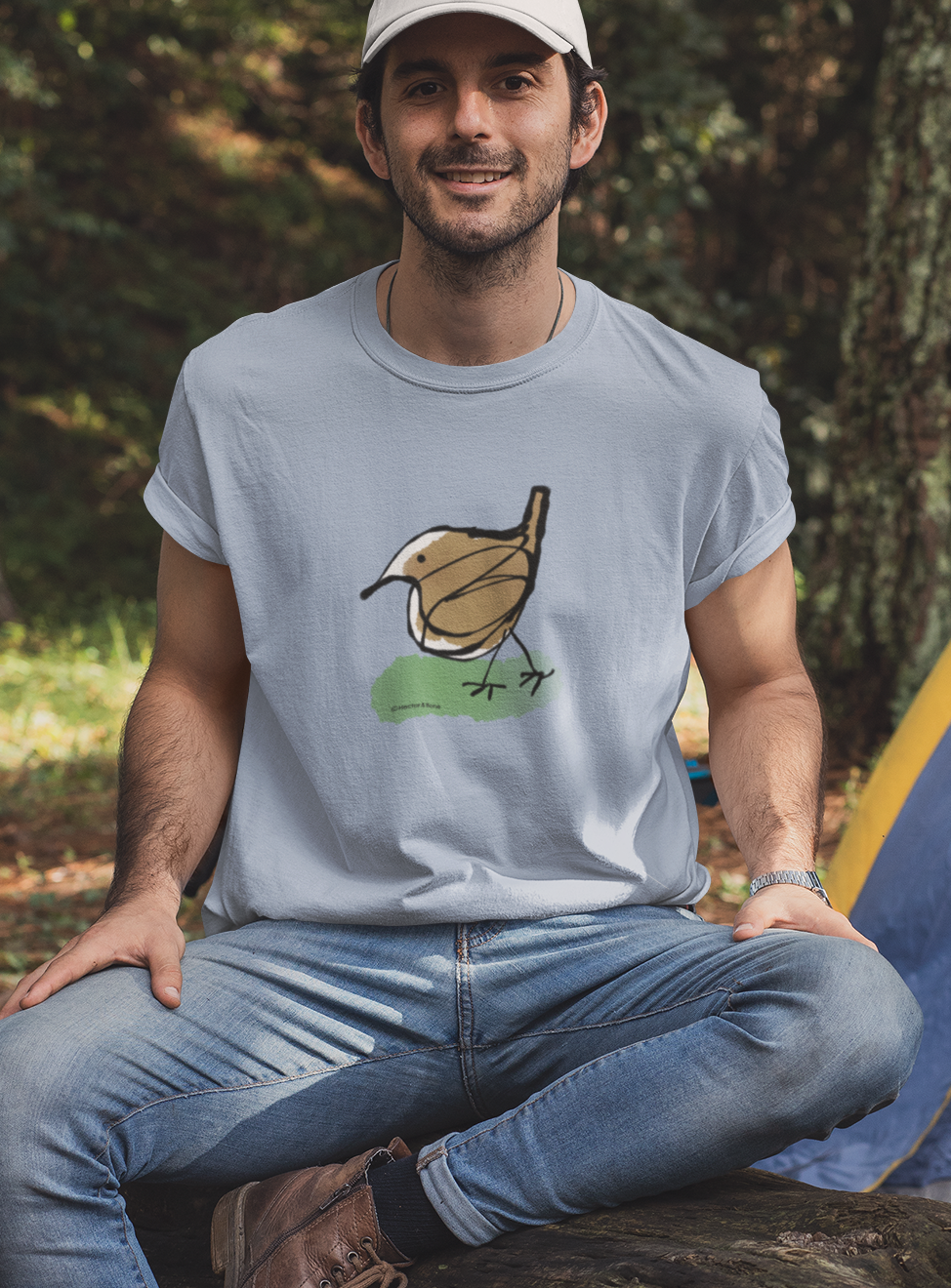 Jenny Wren T-shirt - Young man wearing illustrated little Jenny Wren bird t-shirt on sky blue vegan cotton t-shirts by Hector and Bone