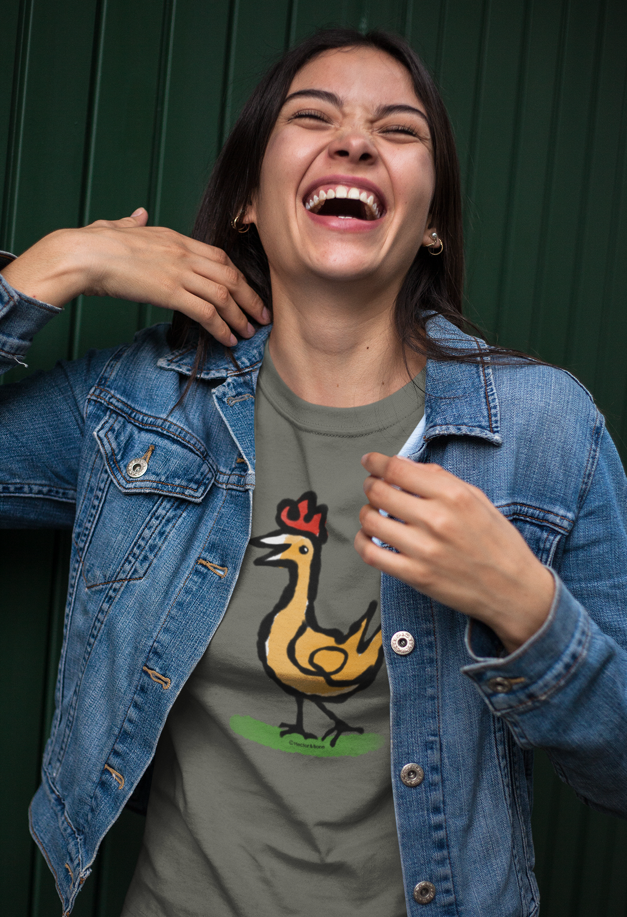 Happy Chicken T-shirt - Laughing young woman wearing Illustrated Funny Chicken design on khaki colour vegan cotton t-shirts by Hector and Bone