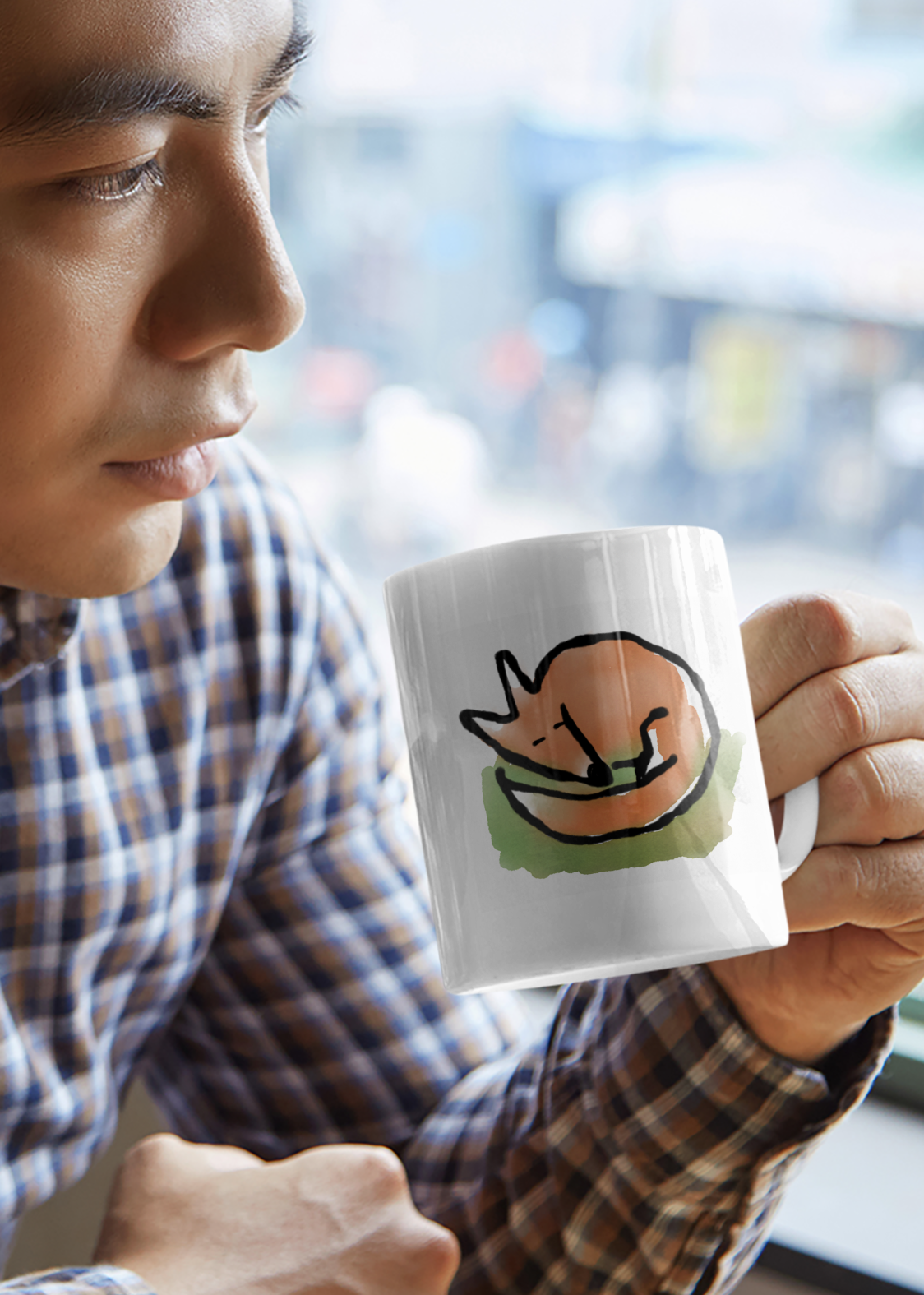 A man drinks from an original Hector and Bone cute illustrated Sleeping Fox ceramic coffee mug