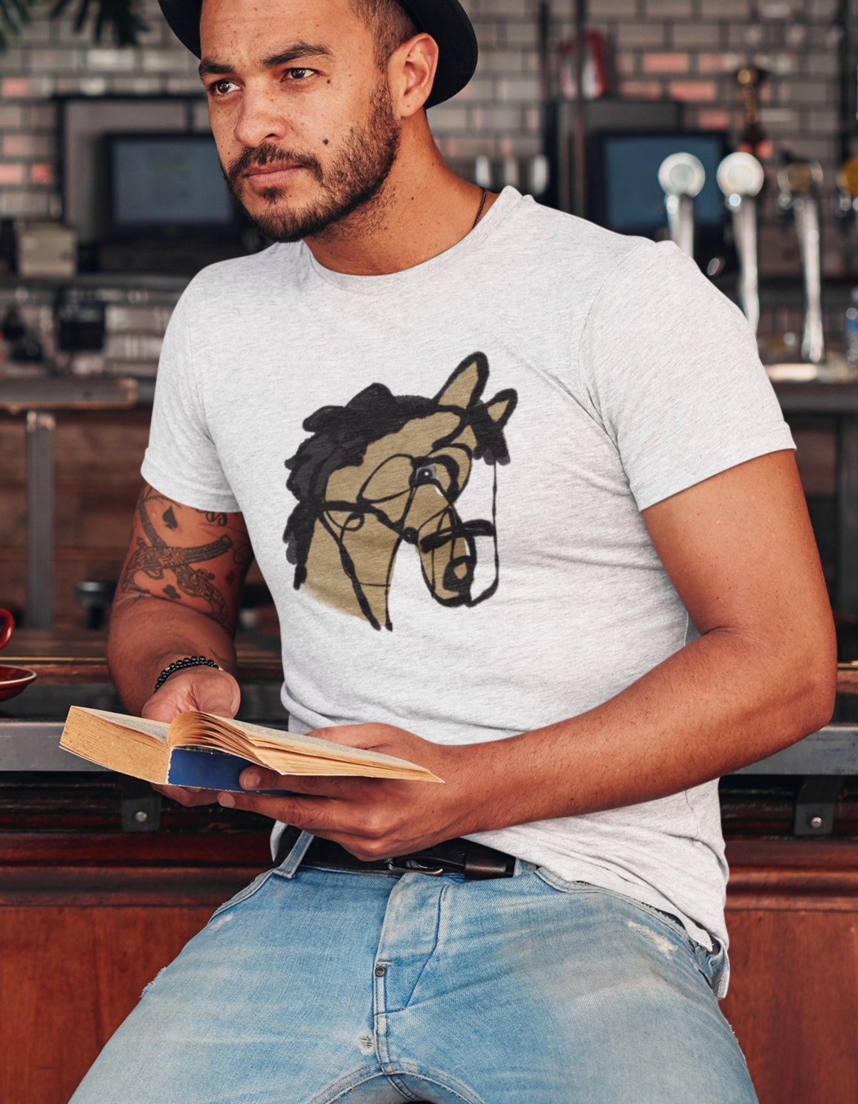 Horse T-shirt - Young man in a bar wearing a illustrated I love my horse original design pony t-shirt by Hector and Bone
