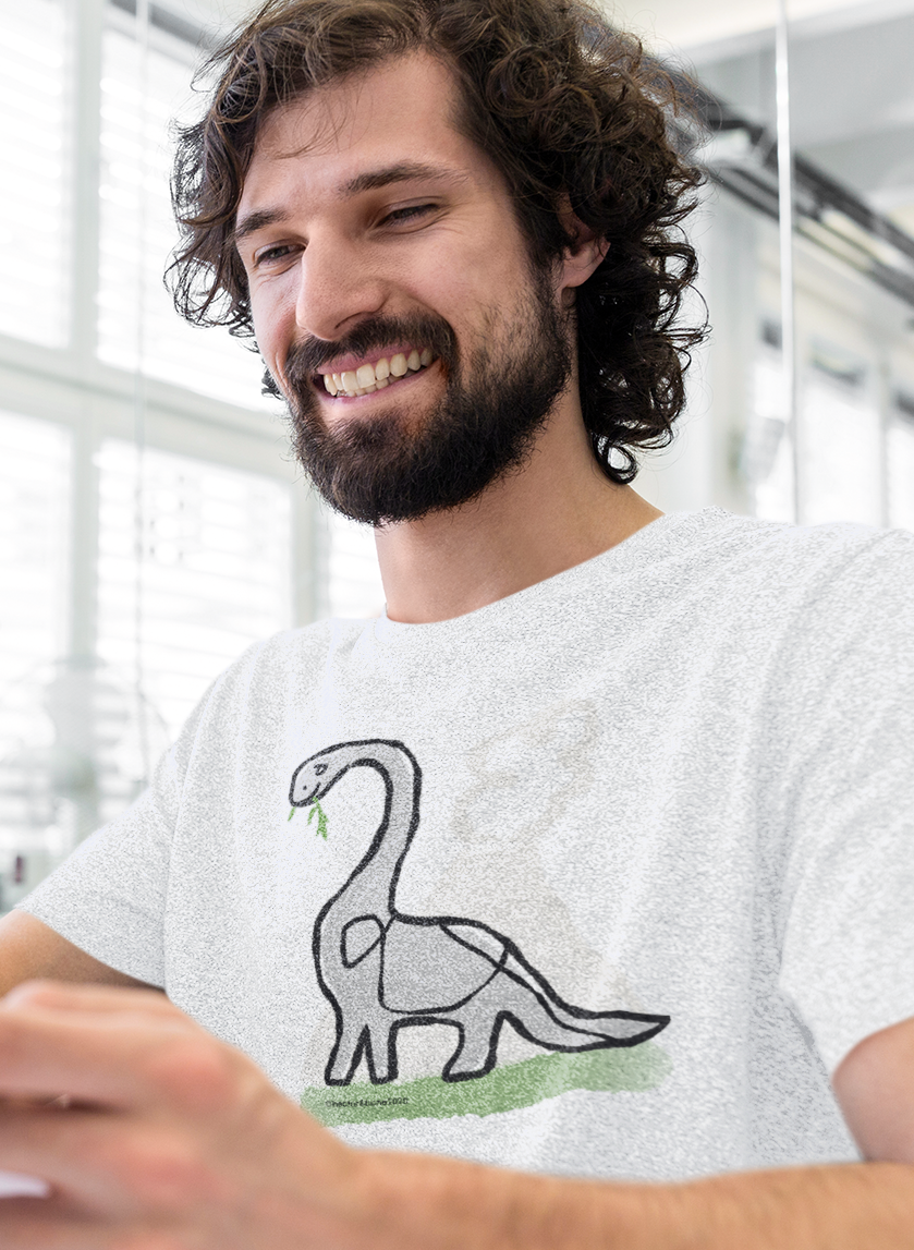 A man wearing a cute derek dinosaur illustrated design by hector and bone on a t-shirt