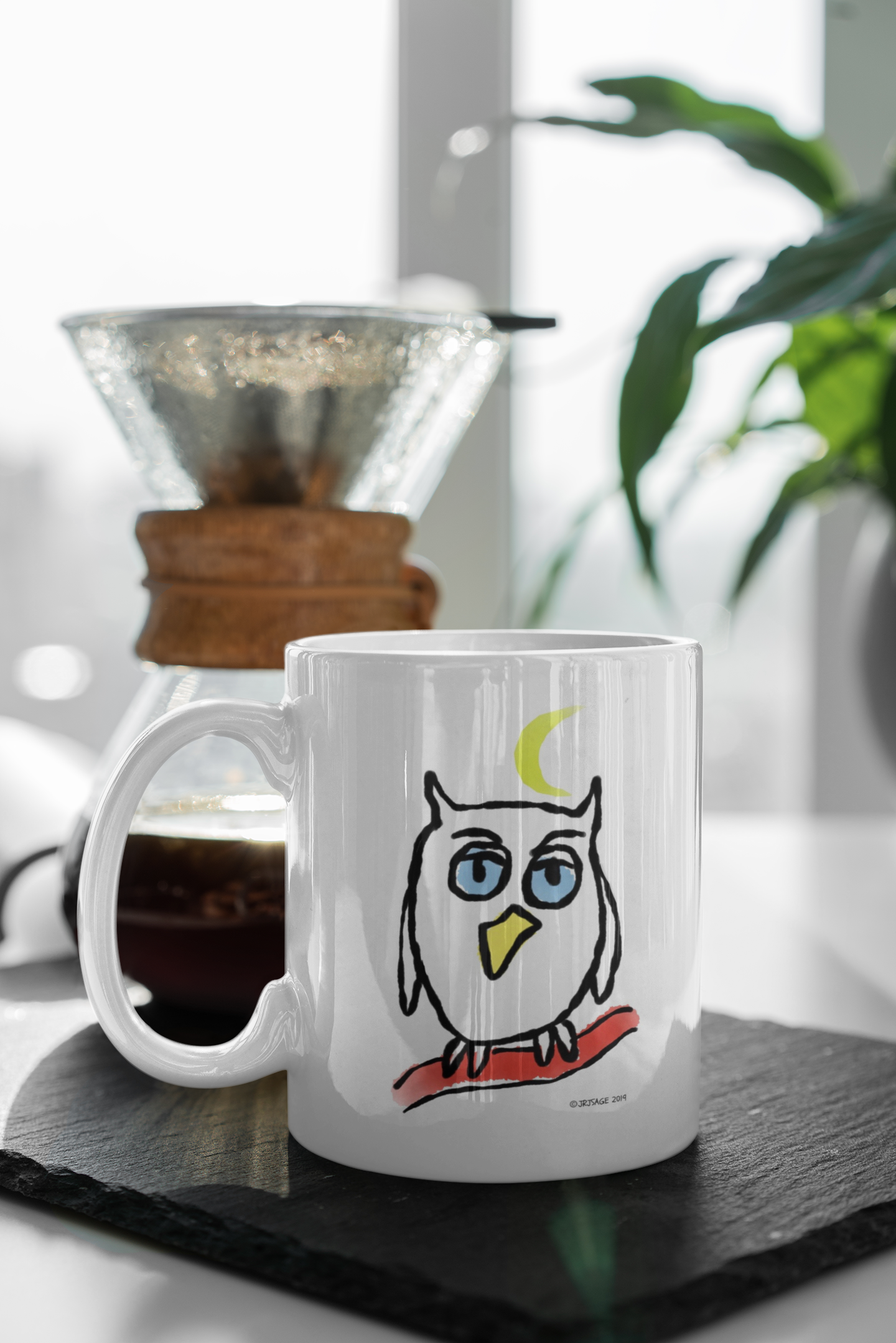 Night Owl Mug Illustrated cute owl mug design by Hector and Bone on a table