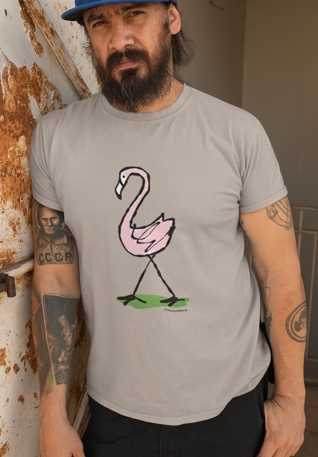 Pink Flamingo T-shirt - Man wearing an illustrated flamingo t-shirt design on sand tee by Hector and Bone