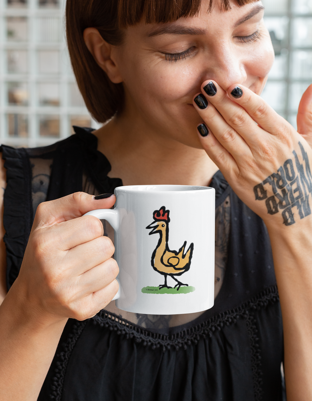 A smiling woman holding a White Hector and Bone Mug with illustration of a Happy Chicken