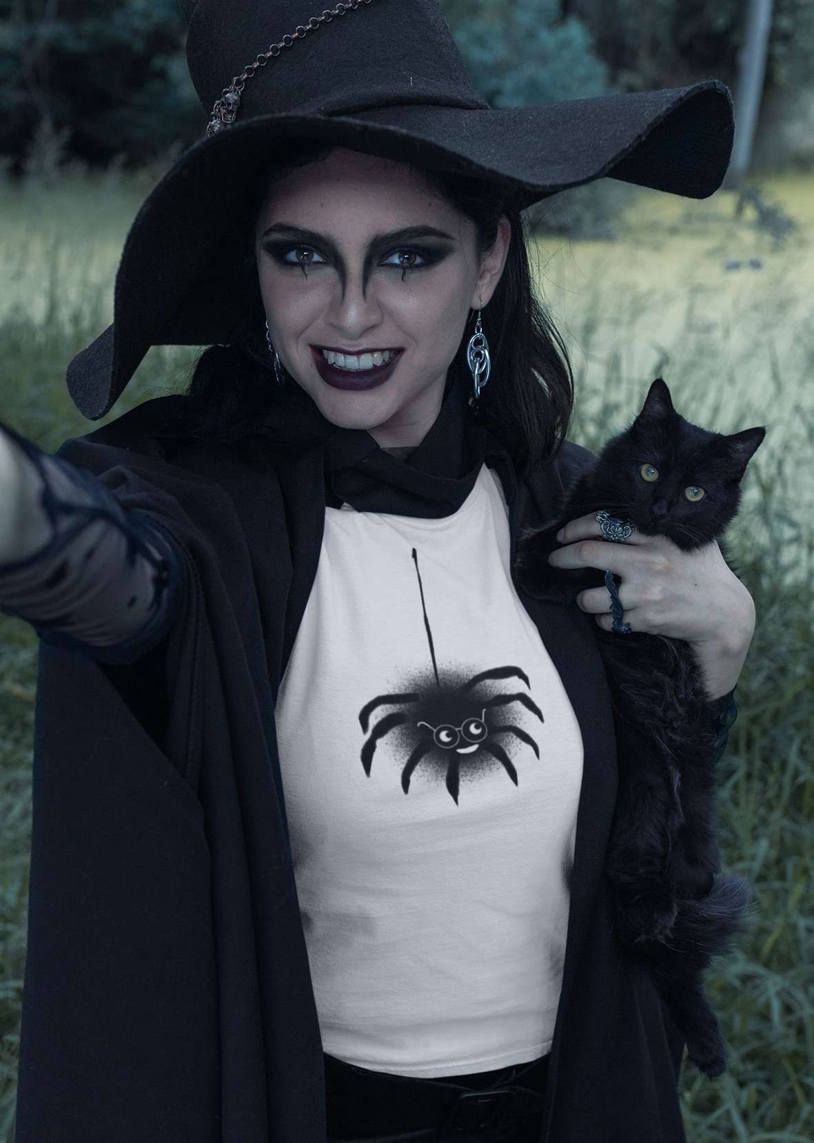 Spider T-shirt - A young woman dressed as a witch for Halloween wearing a cute Spencer Spider original illustrated design on a Hector and Bone quality vegan cotton t-shirt