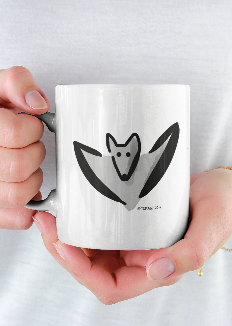 Woman holding a Cute Bertie Bat illustrated Halloween coffee mug by Hector and Bone