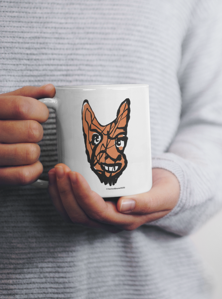 Woman holding a Cheeky Little Devil Halloween original illustrated ceramic coffee mug by Hector and Bone