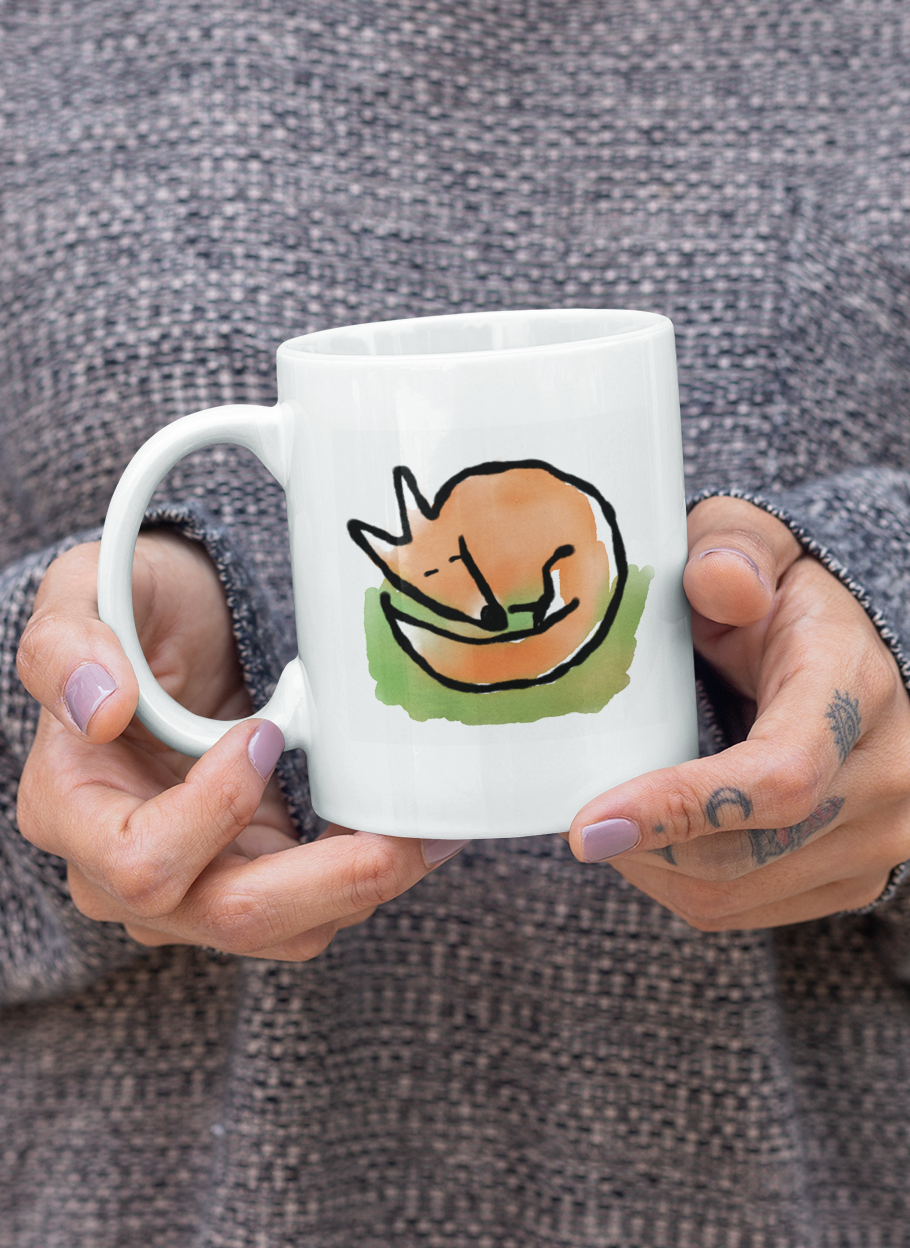 A woman holding a Sleeping Fox mug - Original illustrated Fox coffee mugs by Hector and Bone 