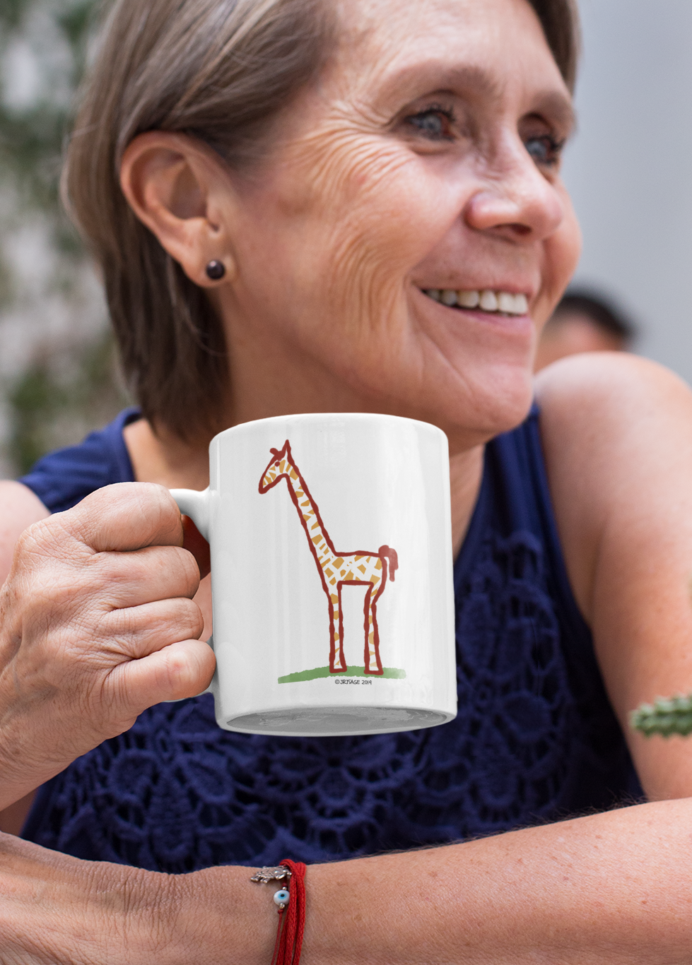Woman holding a Giraffe mug - Illustrated Jeffrey Giraffe coffee mugs by Hector and bone