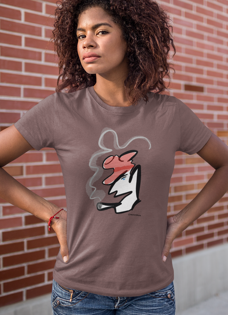 Young woman wearing a stylised illustrated design of Parisian smoking man portrait on a coffee colour vegan cotton t-shirt by Hector and Bone