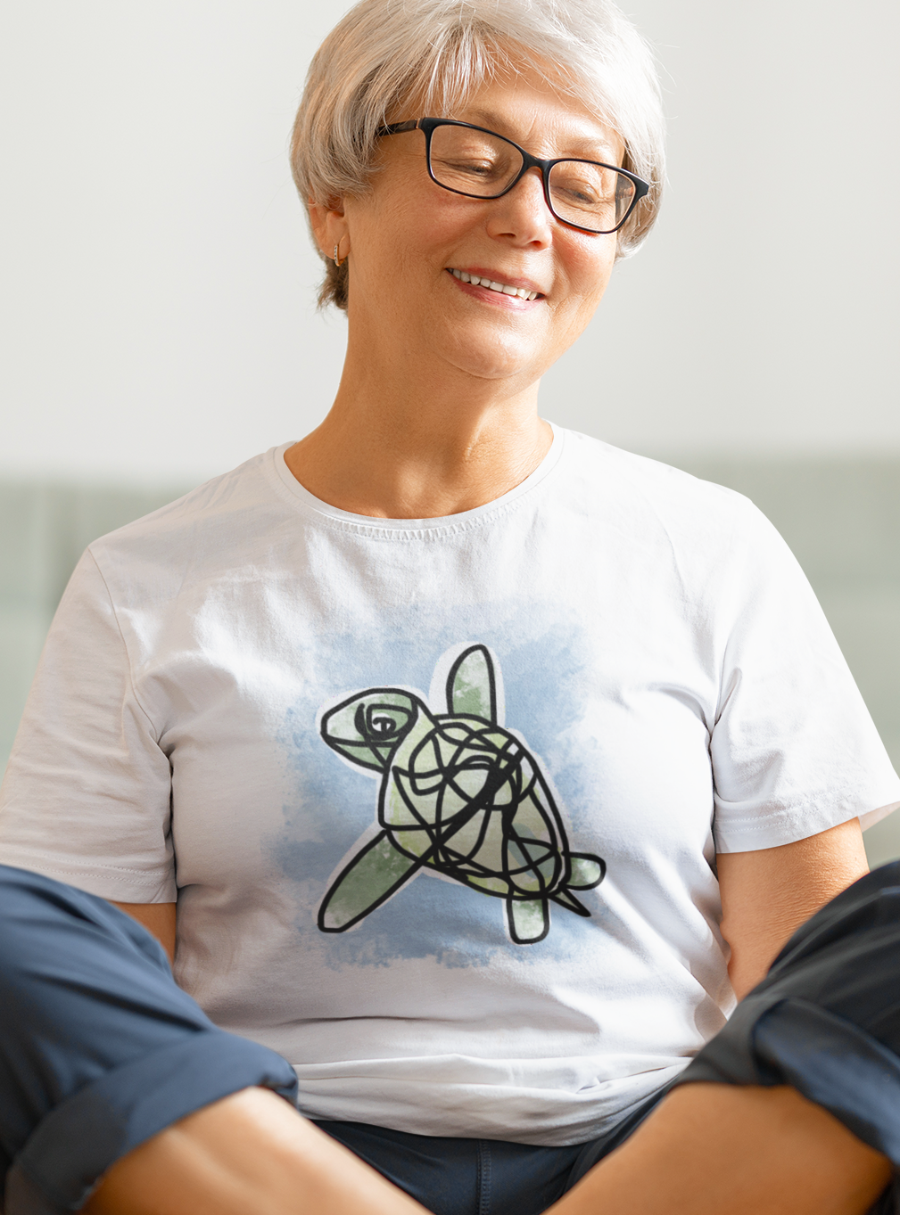 Sea Turtle T-shirt - Woman wearing an illustrated green sea turtle t-shirt by Hector and Bone