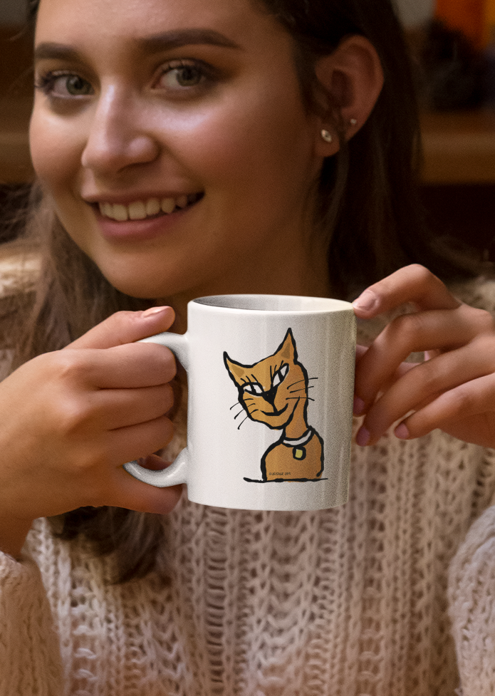 A young woman holding a White Ceramic Hector and Bone Mug with a cute Smiling Ginger Cat illustration