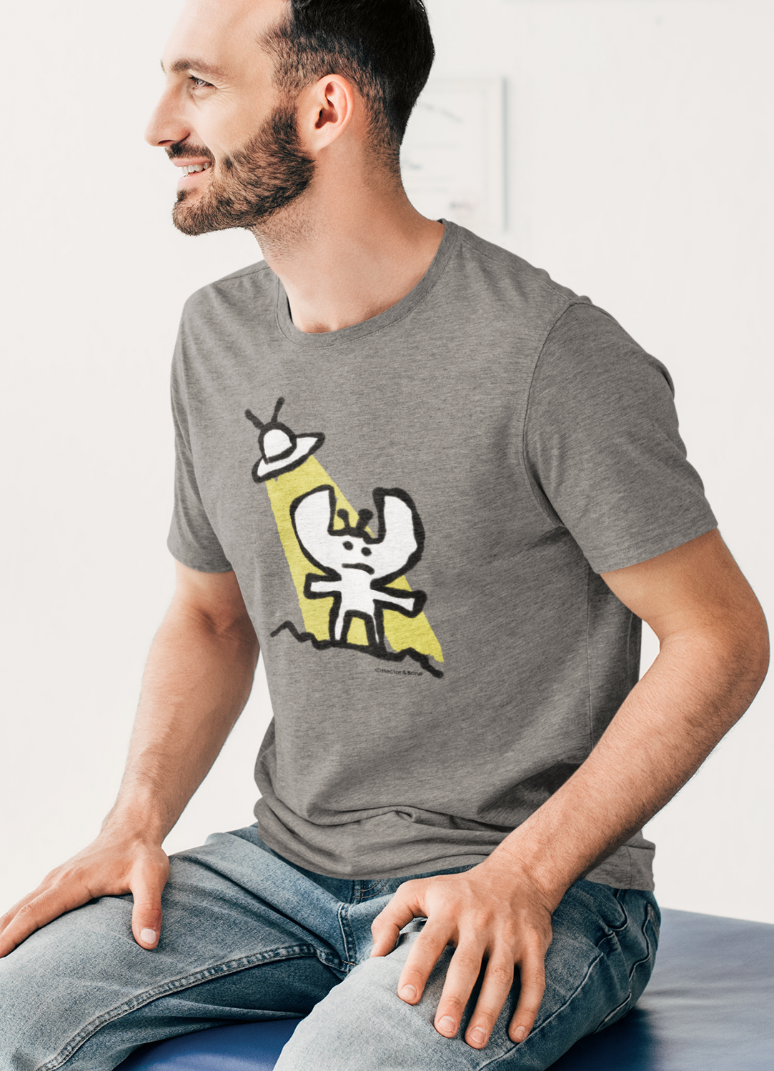 Alien T-shirt - Man wearing a cute Alien and his spaceship tee illustrated on a mid heather grey vegan t-shirt by Hector and Bone