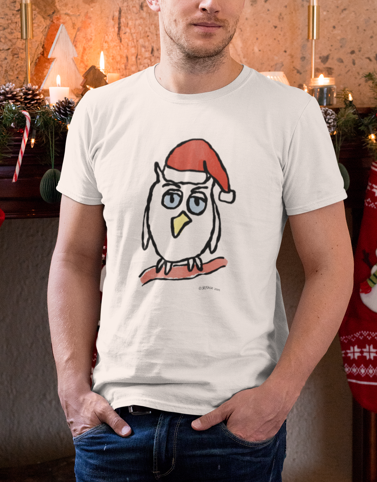 Young man wearing a Santa Night Owl cute Christmas T-shirt illustrated design by Hector and Bone on a vegan cotton t-shirt