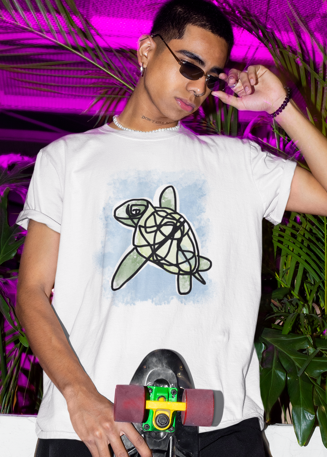Sea Turtle T-shirt - Young man wearing an illustrated green sea turtle t-shirt by Hector and Bone