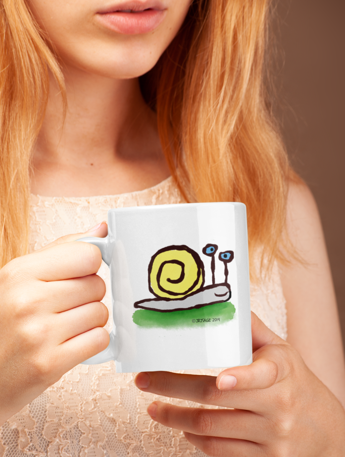 Woman holding Cute Sly the Snail illustrated coffee mug designed by Hector and Bone
