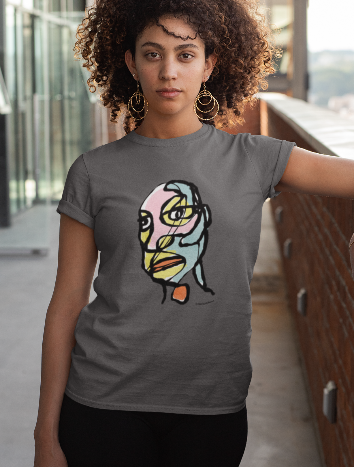 Abstract man portrait t-shirt - Young man wearing an Edgy Eddie abstract man's face illustrated on a vegan dark grey cotton t-shirt by Hector and Bone