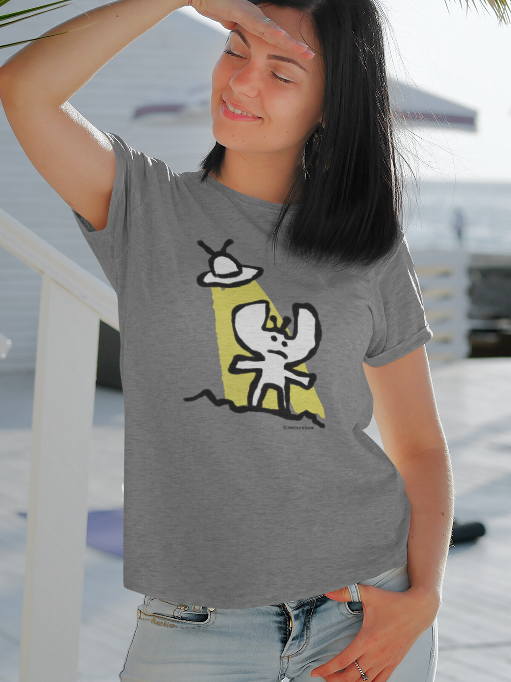 Alien T-shirt - Young woman wearing a cute Alien t-shirt illustrated on a mid heather grey vegan t-shirt by Hector and Bone