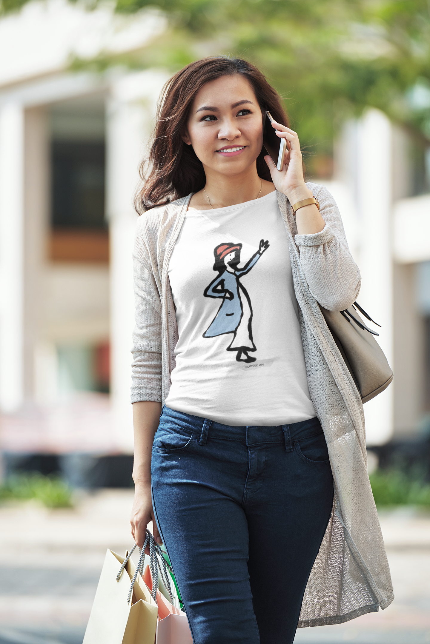A young woman wearing a cotton t-shirt with printed illustration of a waving girl design by hector and bone